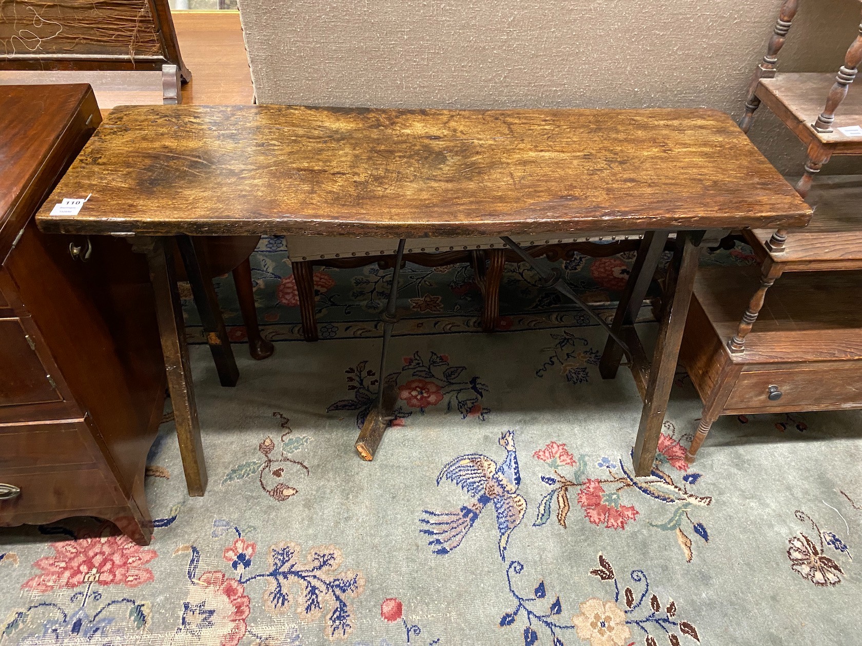 An 18th Spanish walnut rectangular topped table, with iron stretchers., Provenance: Gorringe’s, contents of Jevington Place, nr. Eastbourne, 30th July, 1986, lot 88, width 126cm, depth 41cm, height 80cm (damaged stretche